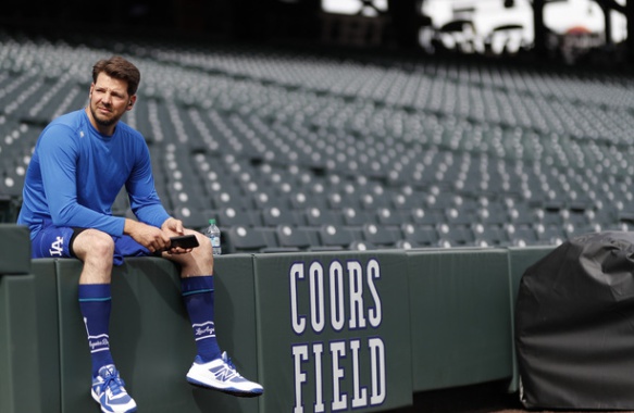 Los Angeles Dodgers starting pitcher Rich Hill takes a break while warming up before facing the Colorado Rockies in a baseball game Friday, April 5, 2019, in Denver. (AP Photo/David Zalubowski)