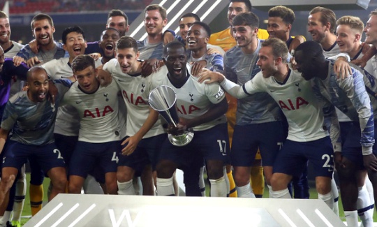 Tottenham's players celebrate after winning the friendly soccer Audi Cup match between FC Bayern Munich and Tottenham Hotspur at the Allianz Arena stadium in Munich, Germany, Wednesday, July 31, 2019. (AP Photo/Matthias Schrader)