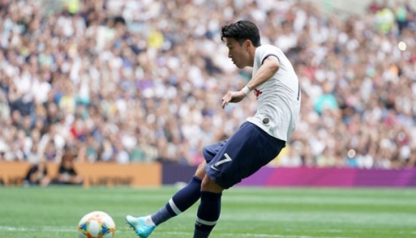 Tottenham Hotspur's Heung-Min Son scores a penalty during the International Champions Cup soccer match between Tottenham and Inter Milan at Tottenham Hotspur Stadium, London, Sunday, Aug. 4, 2019. (John Walton/PA via AP)